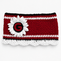 Deep red crochet ear warmer headband with a white sunflower and crocheted red Georgia G on a black center, white stitched stripes, black top trim, and scalloped white bottom trim