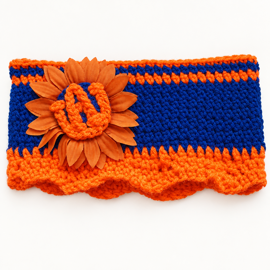 Auburn sunflower crochet headband laid flat, showing the navy blue body, orange scalloped trim, and the sunflower with AU letters