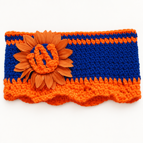 Auburn sunflower crochet headband laid flat, showing the navy blue body, orange scalloped trim, and the sunflower with AU letters