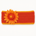 Handmade crocheted sunflower headband in dark orange with golden orange trim and a fabric sunflower accent