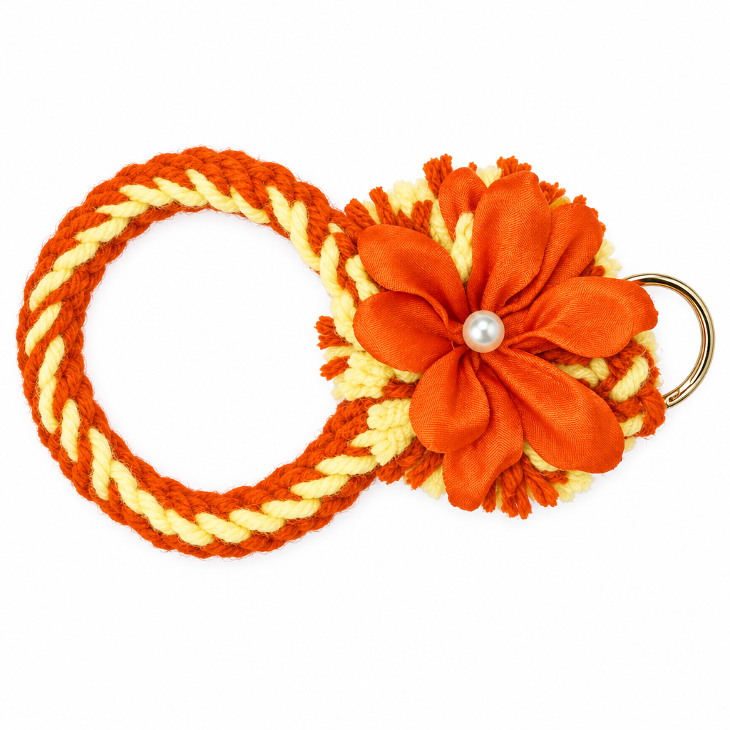 Orange and cream twisted yarn wristlet keychain with large orange flower and pearl center